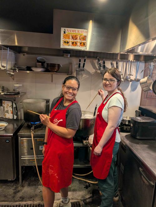 Dr. Mikaela Melnychuk with medical school classmate, Stacy Nguyen, cooking.